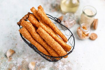 Italian grissini or salted bread sticks with sesame seeds.