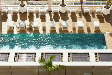 Swimming pool on roof top of yacht club in Monaco, premium spa recreation, Monte Carlo, palm tree,...
