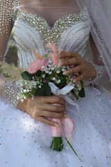 bride and groom holding hands