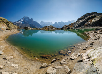 Fototapeta na wymiar mountain lake Lac Blanc in Chamonix with mountains of the Mont Blanc Massiv in the distance