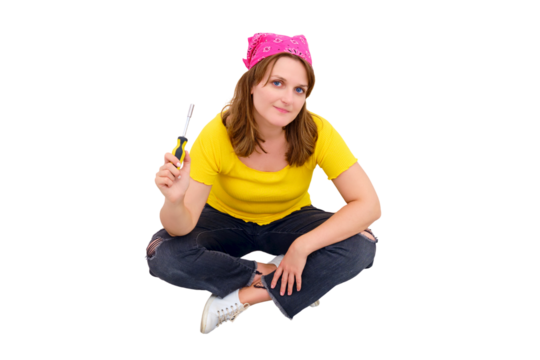 A young woman sits on the floor next to a tool kit with a screwdriver in her hands, isolated on a white background - Powered by Adobe