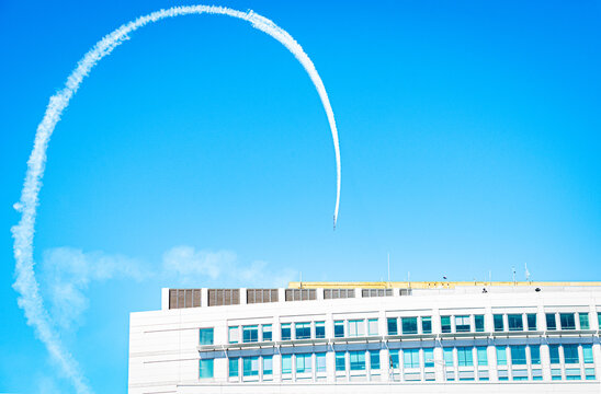 SAN FRANCISCO, CA, U.S.A. - OCT. 5, 2023: Photo of group of four U.S. Navy Blue Angel stunt planes flying a loop in downtown during Senator Diane Feinstein's memorial service. 