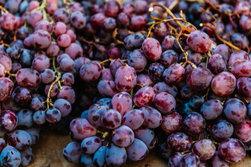 Close up of raw organic sweet red grapes, wine grapes texture.