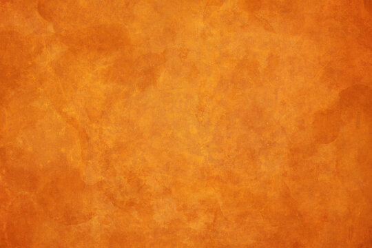 Painted orange background watercolor texture, elegant orange paper with old vintage textured design, autumn, thanksgiving and halloween colors