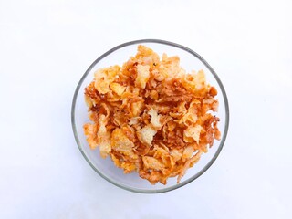 spicy and sweet corn chips. crushed corn chips on white background