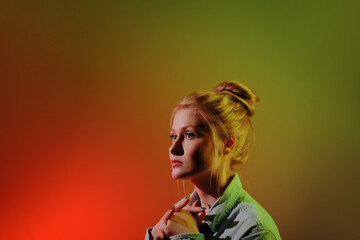 Colorful close-up studio portrait of a young woman