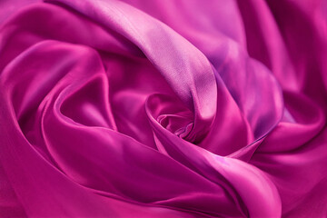 Obraz premium Pink silk fabric making swirl pattern fashion background. Datin spiral wave abstract design, smooth elegant rose cloth curve, soft folds luxury backdrop