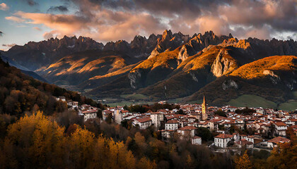 Riano cityscape at sunset with mountain range landscape during Autumn in Picos de Europa National Park