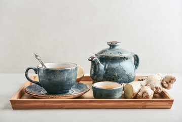 Ginger tea with lemon in a blue cup