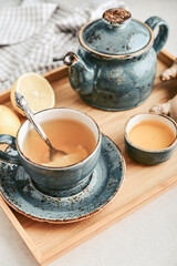 Ginger tea with lemon in a blue cup