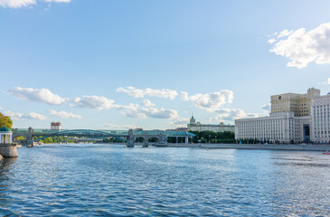 View of the Ministry of Defence of Russian Federation, and Moscow river embakment with cruise ships at sunset.