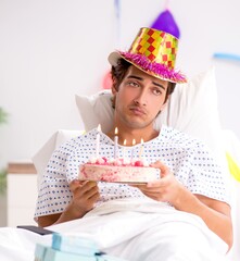 Young man celebrating his birthday in hospital