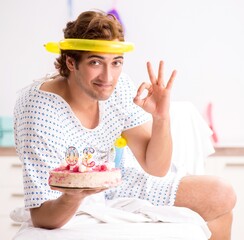 Young man celebrating his birthday in hospital