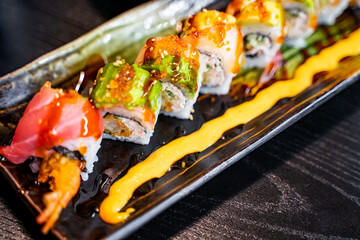 The rainbow rolls in the Japanese restaurant. 