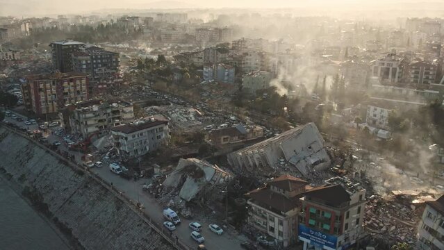 Earthquake damage in a city, collapsed buildings.Search and rescue teams and paramedics rescue the victims among the debris and rubble destroyed by the earthquake.Ruins, destruction, tragedy,disaster.