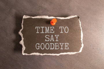 Text TIME TO SAY GOOD on sticker and colored background.