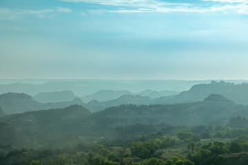 Foggy and Smoky Blue Layers of Hills and Mountains Receding into the Distance, Theodore Roosevelt National Park, Badlands, Medora, North Dakota - obrazy, fototapety, plakaty