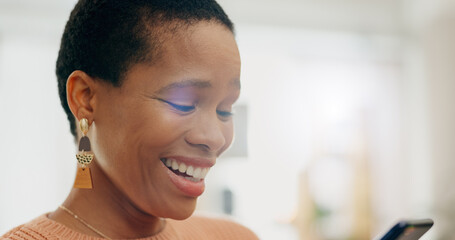 Smile, black woman and a chat on a phone for communication, social media or a notification. Happy, contact and an African girl reading from a website, streaming app or search on a mobile in a house