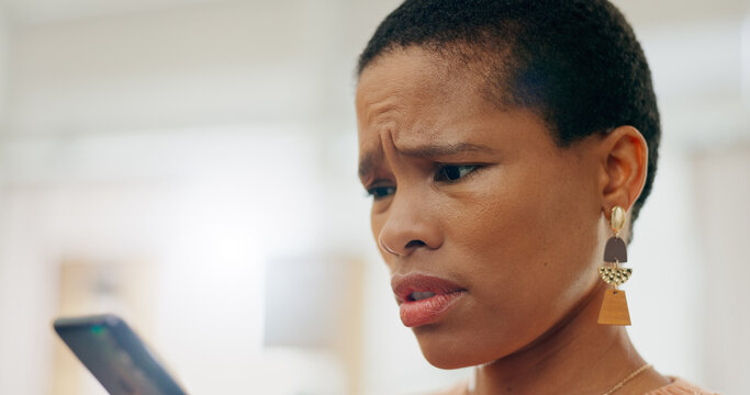 Confused, Sad And Black Woman With A Phone For Communication, Bad News Or A Breakup Online. House, Problem And An African Girl Reading An Email, Social Medi Notification Or App With Fear On A Mobile