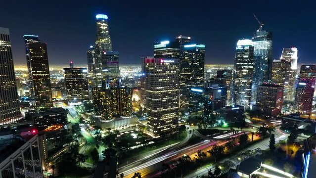 Aerial Time Lapse Shot Of Skyscrapers Near Light Trails On Streets In City At Night - Los Angeles, California
