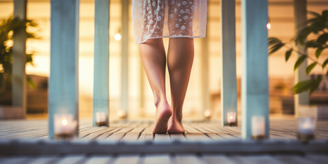 Close-up of healthy ladies legs at spa wearing dressing gown, walking on rustic floor - obrazy, fototapety, plakaty