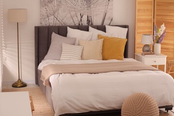 Light bedroom interior with comfortable modern bed