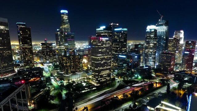 Aerial Lockdown Time Lapse Shot Of Illuminated Buildings And Roads In City At Night - Los Angeles, California
