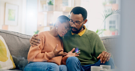 Sad, home and black couple with hug, conversation and emotions with discussion, grief and loss. People, apartment and man with woman, embrace or talking with reaction, crying and support with anxiety