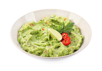 Delicious guacamole served with lime, pepper and parsley isolated on white