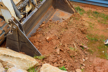 Mini bulldozer proficiency in earthmoving operations facilitates completion of landscaping works