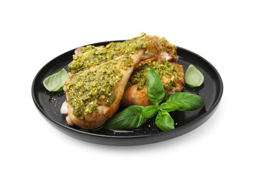 Delicious fried chicken drumsticks with pesto sauce and basil isolated on white