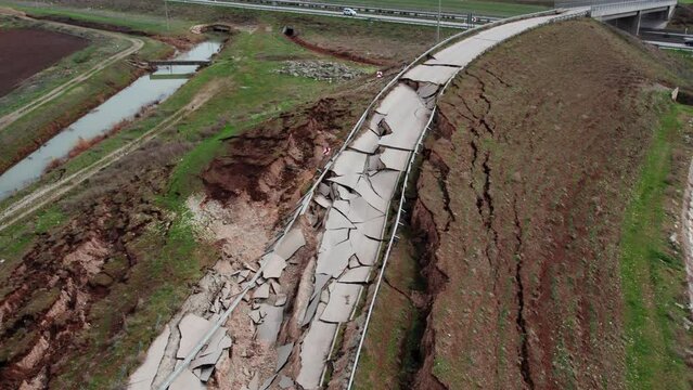 Heavy damage in the earthquakes, some roads became completely unusable. It collapsed due to fragmentation and cracks in the connecting roads.Close-up of ruined road or street with parts of asphalt.