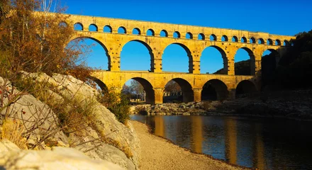 Foto op Plexiglas Pont du Gard Picture of old Roman Bridge Pont du Gard in autumn in South of France