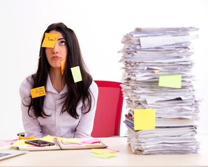 Young female employee in conflicting priorities concept