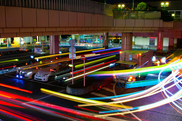 A night timelapse of traffic jam at the bus rotary in Tokyo telephoto shot