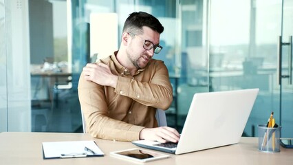 Allergy attack. Itch or pruritus Young businessman scratching suffering from allergic reaction or mosquito bite sitting at workplace in office. Male has scabies or as a result of stress scratches body