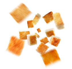 Delicious crispy croutons falling on white background