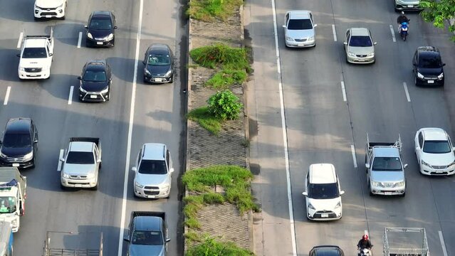 Traffic jam : In the heart of the motorway chaos, the drone soars above a twisted maze of vehicles, trapped in a symphony of honking horns and frustrated souls. Economic Costs: Productivity loss. 4K.
