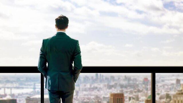 Business man overlooking city skyline background from office 