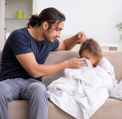 Fototapeta premium Father taking care of his ill daughter