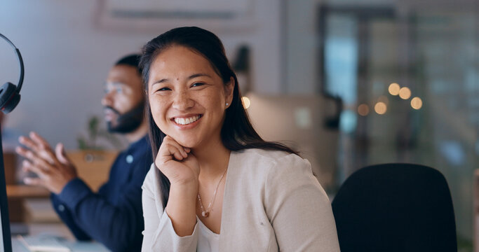 Happy Asian Woman, Portrait And Call Center At Night For Customer Service, Support Or Telemarketing At Office. Female Person, Consultant Or Agent Working Late With Smile For Help Or Online Advice