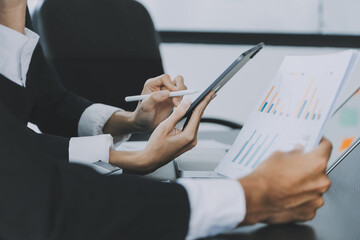Close up of Business team analyzing income charts and graphs with modern laptop computer. Business analysis and strategy concept.