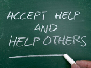 Accept help others, quote text written on chalkboard, motivation inspiration