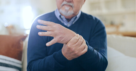 Home, injury and senior man with wrist pain, bruise or inflammation with muscle tension in a...