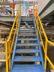 Fototapeta na wymiar Blue stairs in the factory