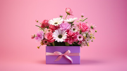 an arrangement of flowers in a pink box on a pink background. bouquet of peonies, eustoma, spray rose