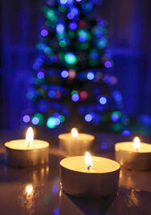 Obraz na płótnie Canvas Holiday, winter mood, red candles and Christmas tree