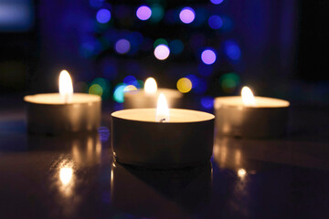 Holiday, winter mood, red candles and Christmas tree
