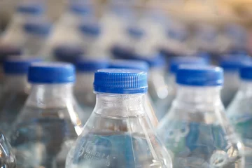 Foto op Plexiglas mineral water bottle in a row  © Towfiqu Barbhuiya 