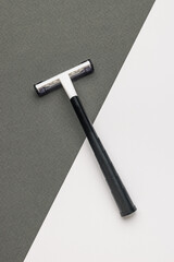 Black and white men's razor on a black and white background.